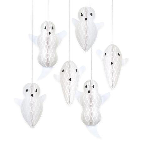 Six white paper honeycomb ghost decorations hanging against a white background.