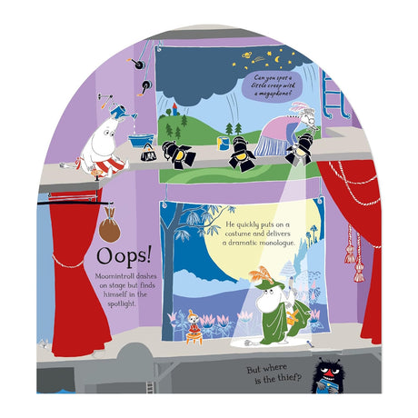 Moomintroll performs in a green cloak under a spotlight on a colorful theater stage.