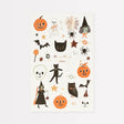 Meri Meri Halloween temporary tattoo sheet featuring pumpkins, cats, witches, and skeletons.