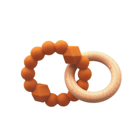A stylish and practical teething toy featuring a soft honey-coloured silicone ring with beaded and geometric textures, paired with a smooth wooden ring.