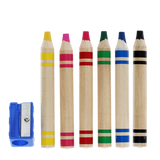 Six colorful jumbo wooden crayons lined up next to a blue sharpener.
