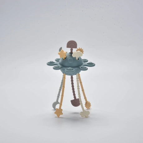 Blue silicone baby pull toy with hanging shapes shown standing in a front view.