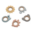 Assorted pastel silicone and wooden baby teething rings shown in a flat lay view.