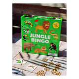 Green box of "Jungle Bingo" with colorful animal illustrations, like lions and toucans, sits on a table with bingo cards and leopard-patterned tokens nearby.