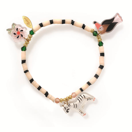A colorful bracelet features small black and beige beads. It has charms of a zebra, flower, and bird, creating a playful, whimsical tone.