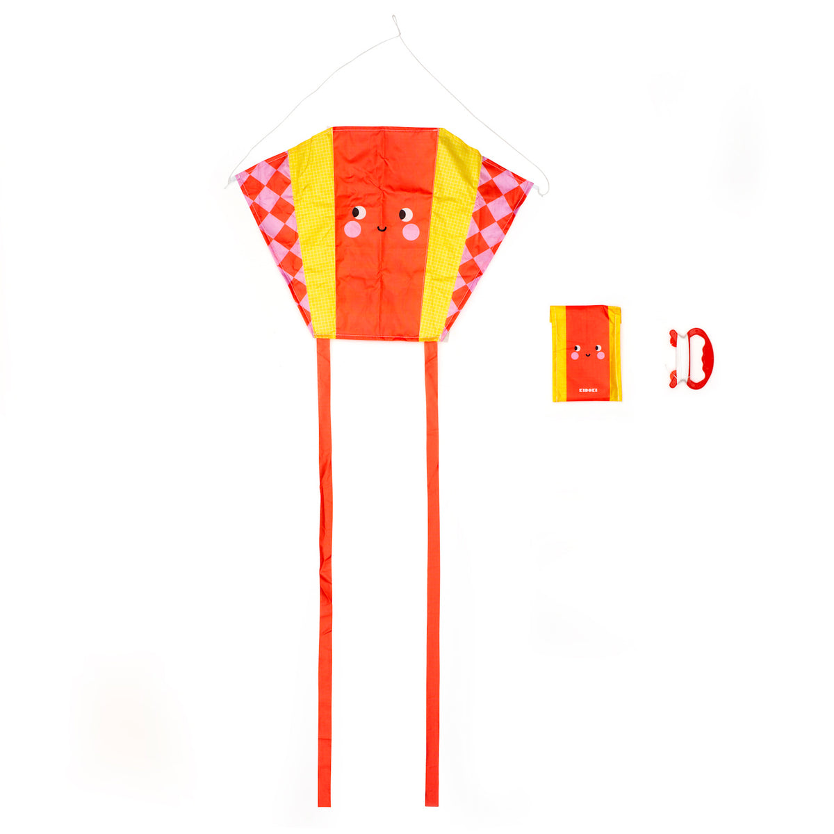 Bright, cheerful kite with a smiling face, featuring red and yellow colors, long tails, and geometric patterns. Includes kite handle and folded storage bag.