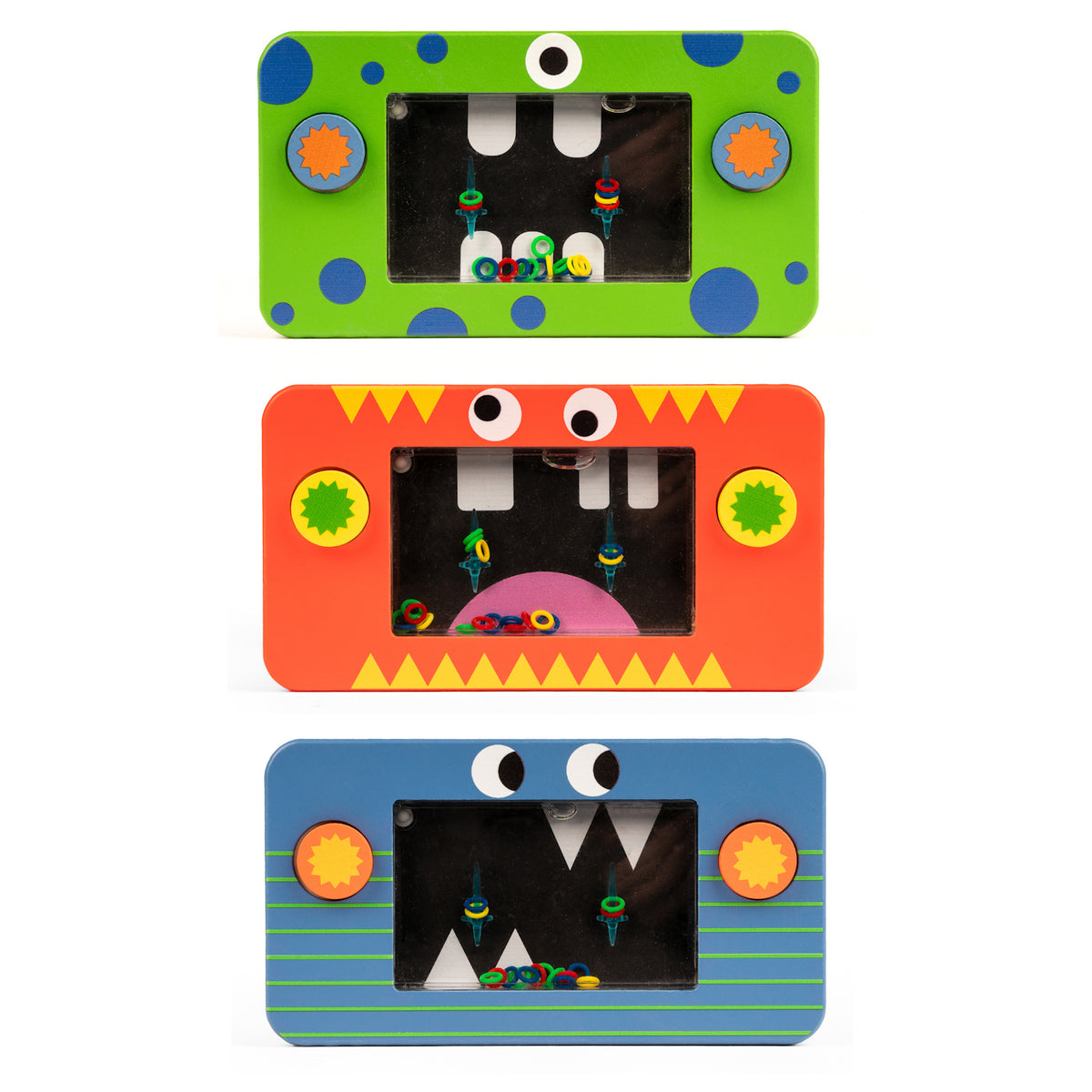 Three colorful rectangular toys arranged vertically, each with a monster face design. From top to bottom: green with blue dots, orange with zigzag teeth, and blue with stripes.