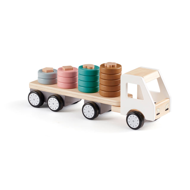 Wooden toy sorter truck carrying stacked colorful rings on pegs, against a white background.