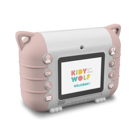 A children’s digital camera with a pink and white design is set against a white background. Its screen displays the colorful text “Kidy Wolf Welcome!” with various control buttons on the sides.
