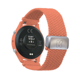 Back view of a coral pink smartwatch with a black sensor base and a braided fabric strap featuring a silver clasp.