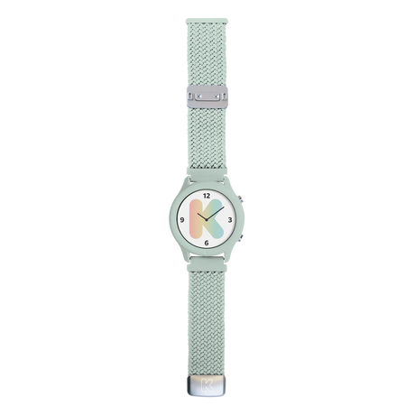 Mint green watch with a braided strap and a white face featuring a large, pastel rainbow letter K.