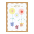 Packaging display for Meri Meri 3 Large Flower Decorations featuring colorful paper flowers on stands.