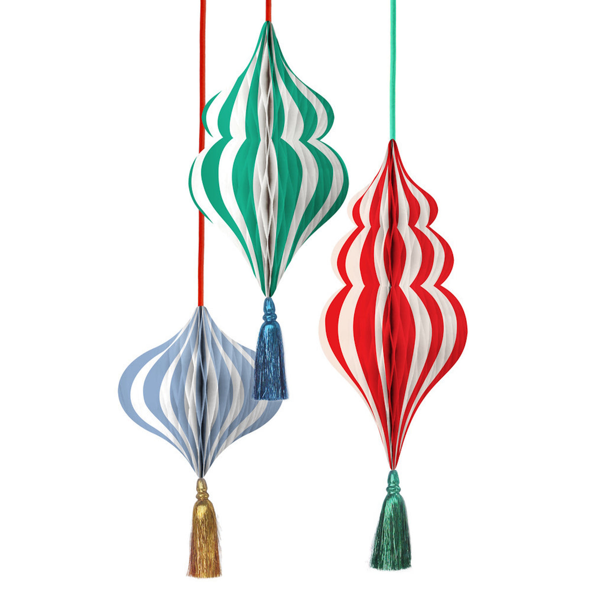 Three striped honeycomb paper ornaments in green, red, and light blue hanging with tassels.