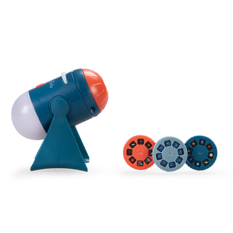 Moulin Roty Les Explorateurs space projector toy tilted with 3 space themed slide discs in orange grey and navy blue.