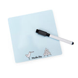 A light blue dry-erase board with a black marker. Simple drawings of a bird and a UFO appear at the bottom.