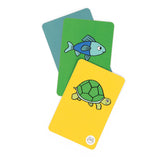Three illustrated game cards showing a blue fish on a green card and a green turtle on a yellow card.