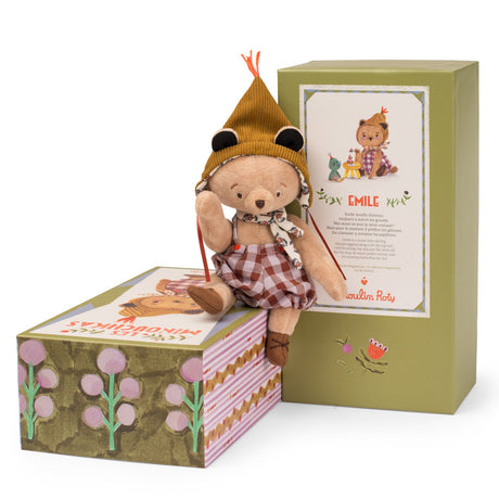 Moulin Roty Emile small bear plush toy sitting on its illustrated gift box, next to the main green packaging.