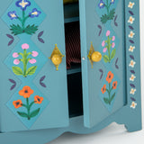 Les Minouchkas blue toy wardrobe doors with painted floral patterns and yellow knobs.