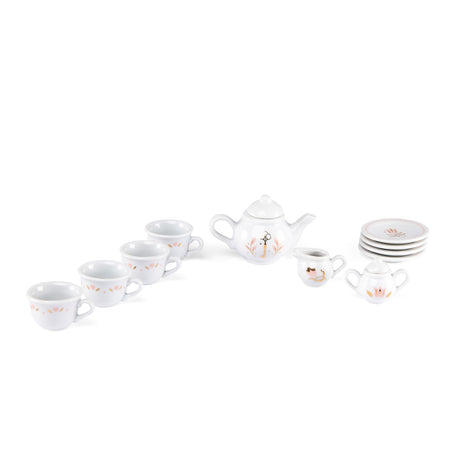 White porcelain kids play tea set with floral details, teacups, and a teapot.