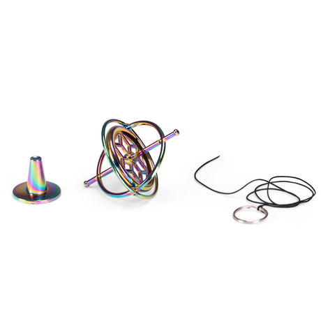 Rainbow metal gyroscope spinning top kit with stand and starter string on white background.