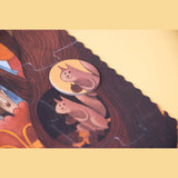 Londji Bears in the Forest puzzle detail showing a squirrel game piece matching an illustration in a hollow tree.