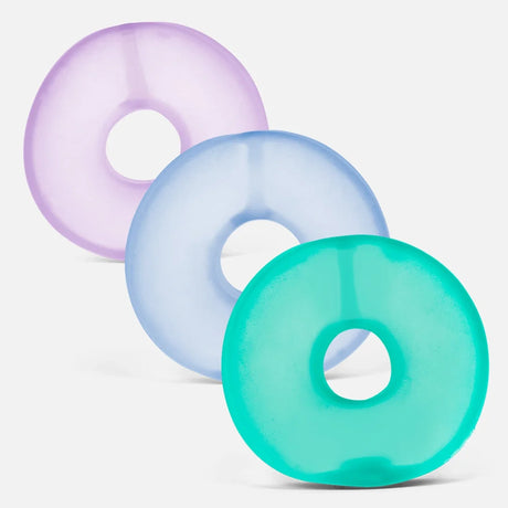 Three colorful ring-shaped memory gel stress loops in purple, light blue, and teal.