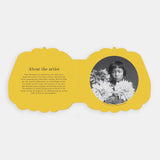 Shaped board book spread featuring "About the artist" text opposite a portrait of young Yayoi Kusama.