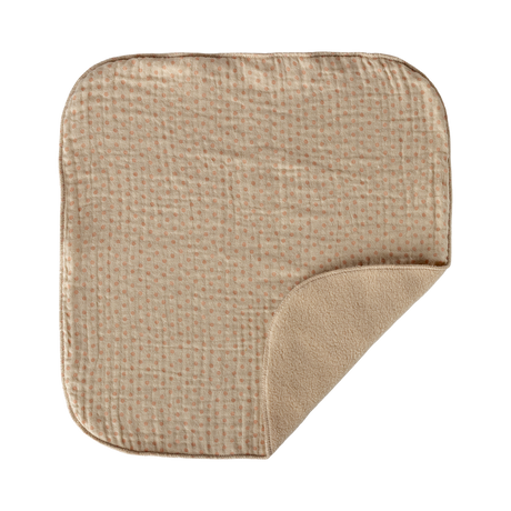 A beige square blanket with rounded corners lies against a white background. It has a subtle checkered pattern and a plush, soft fold in one corner.