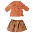 Maileg medium mouse clothing set featuring an orange knitted sweater and a floral patterned skirt.