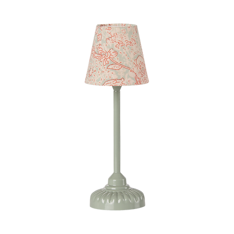 Elegant miniature table lamp with a smooth, green base and a fabric shade adorned with delicate red floral patterns, conveying a classic, cozy ambiance.
