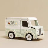 Pastel green and white wooden toy café van with "Café" branding on the side.