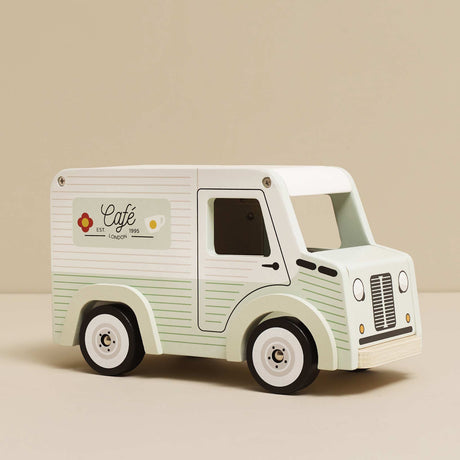 Pastel green and white wooden toy café van with "Café" branding on the side.