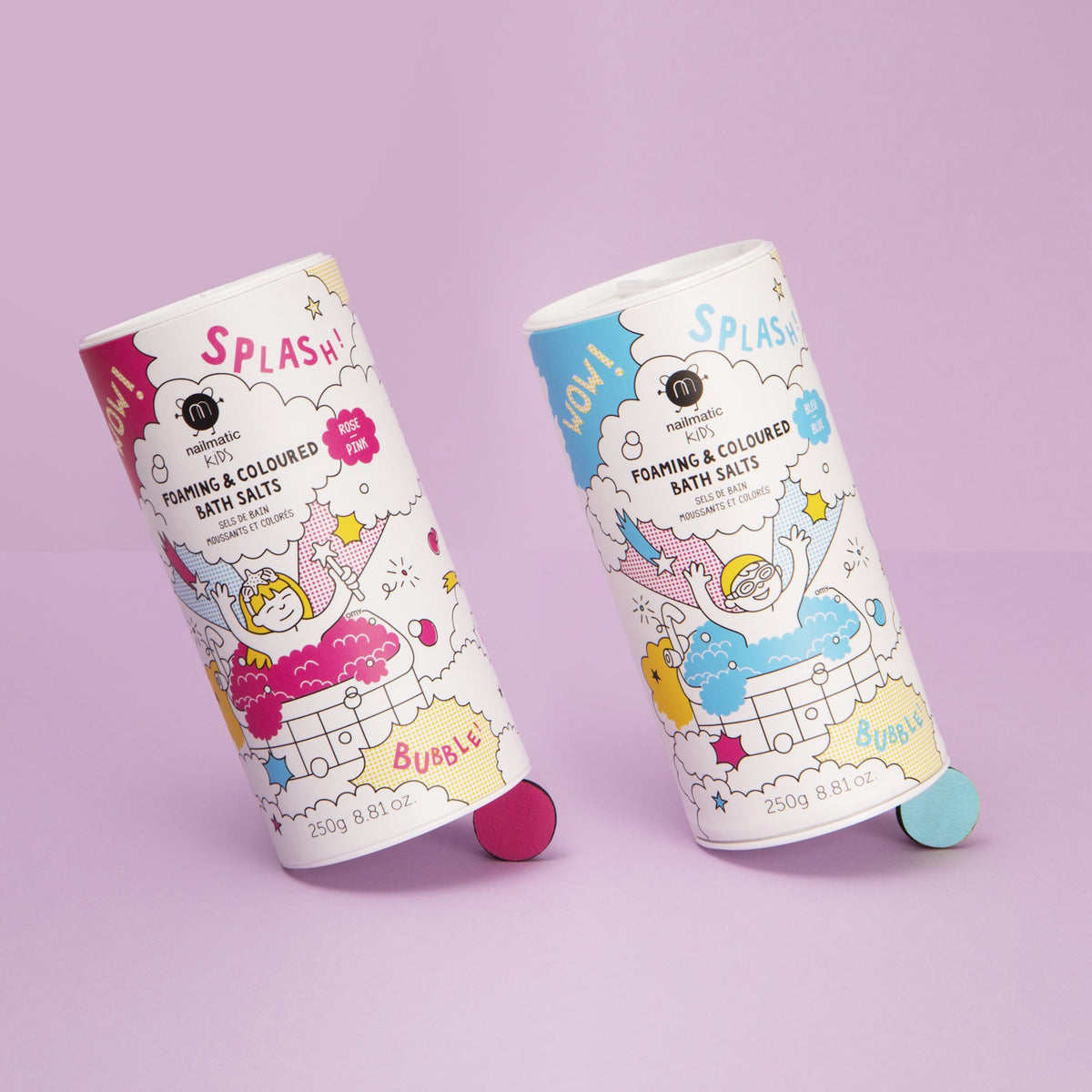 Two colorful cylindrical containers of foaming bath salts with playful illustrations are set against a pastel purple background, conveying a fun and lively mood.