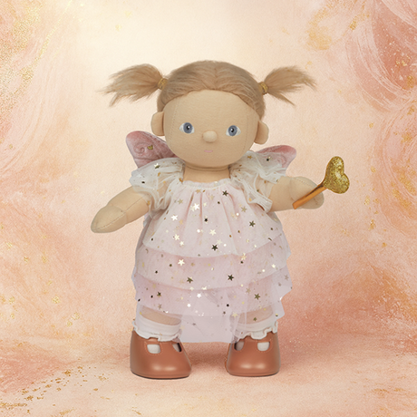 A doll with pigtails wears a pink star-patterned fairy dress, wings, and holds a gold heart wand. The doll has a cheerful expression.