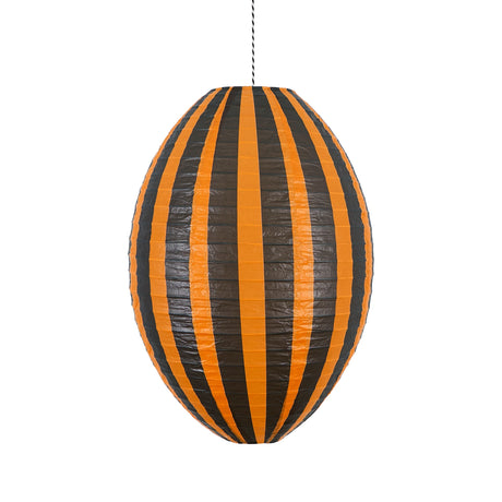 An oval-shaped paper lantern featuring vertical orange and dark brown stripes hanging against a white background.
