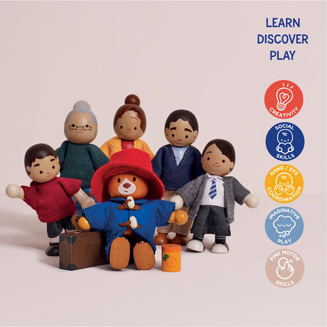 Wooden Paddington Bear and family dolls standing together with educational skill icons on the side.