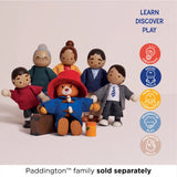 Wooden Paddington Bear figure sitting in front of wooden family figures with learning icons on the right.