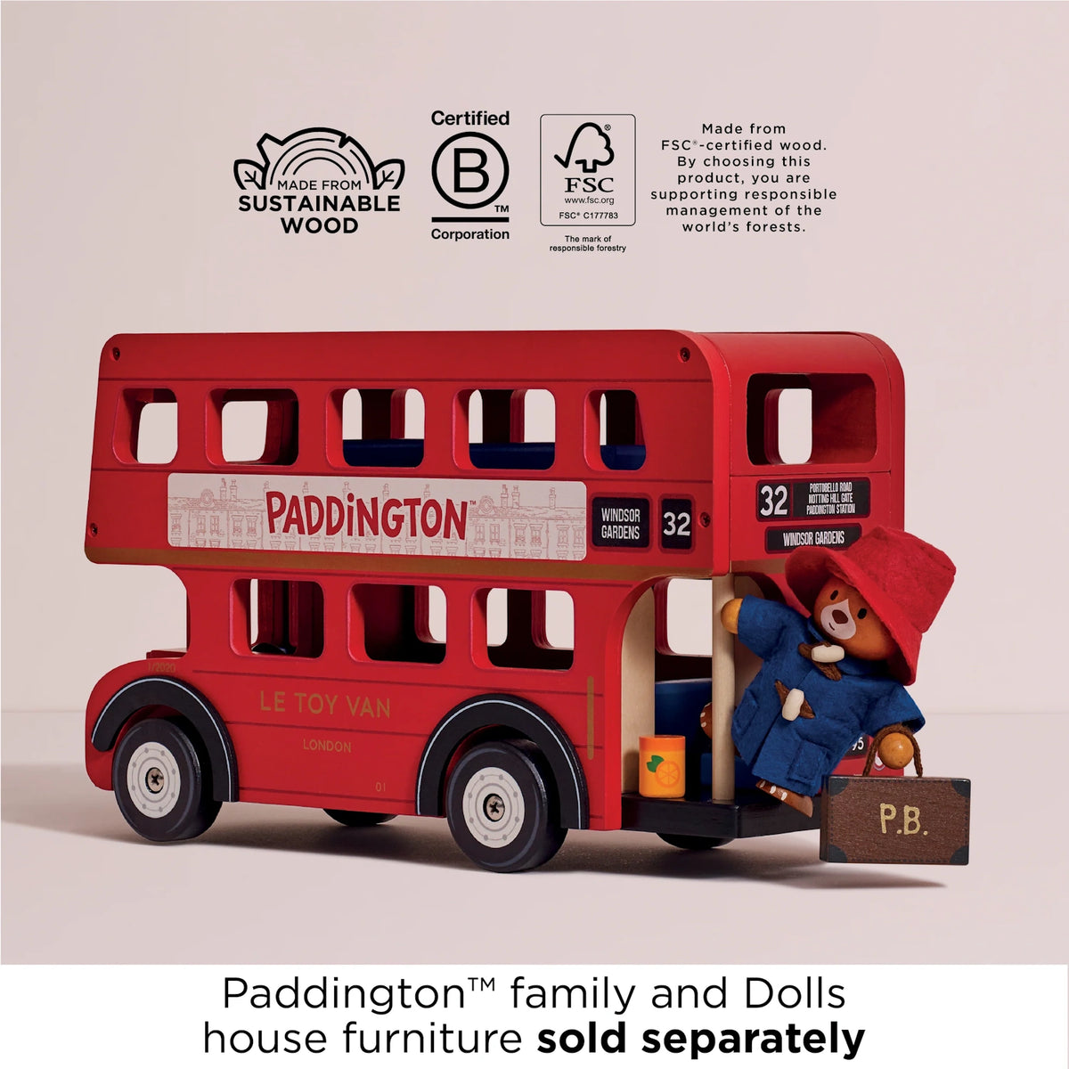 Wooden red London double-decker bus toy with Paddington Bear stepping aboard, featuring sustainable wood logos. 