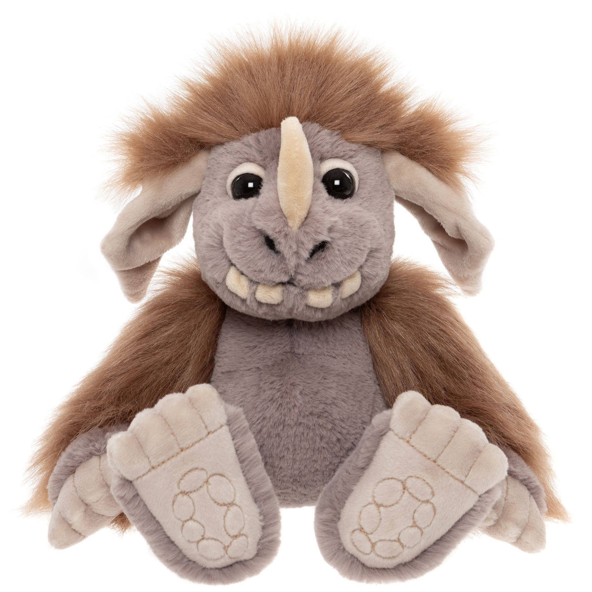 Front view of a grey plush creature with a brown mane, single horn, big feet, and a friendly, toothy grin.