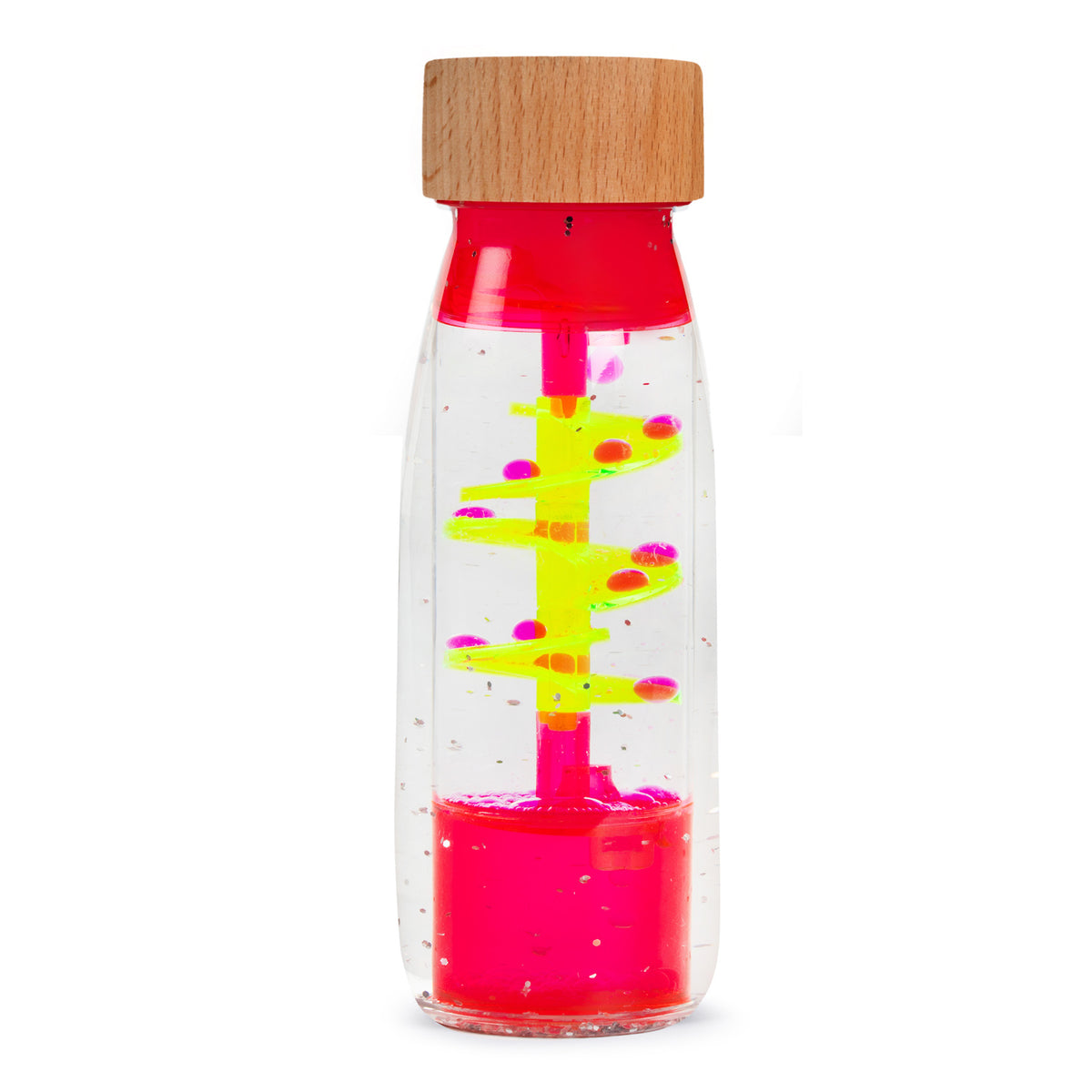 A clear sensory bottle with a wooden top contains bright yellow spirals and pink bubbles. The vibrant contents create a playful, calming visual effect.
