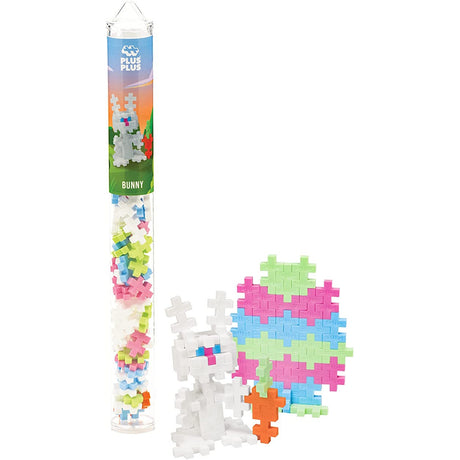 A clear tube filled with pastel puzzle pieces labeled "Bunny." Next to it, a white 3D bunny model and colorful egg shape create a playful vibe.
