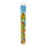 A clear cylindrical tube labeled "Plus Plus Chick" containing colorful interlocking building pieces in yellow, red, blue, and green. Playful and inviting.