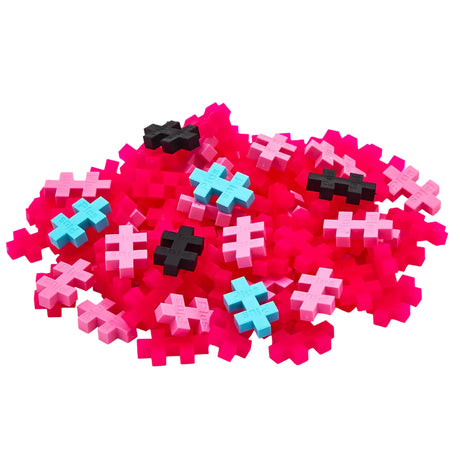 Pile of pink, blue, and black Plus-Plus flamingo-themed construction blocks for creative building and STEM play.