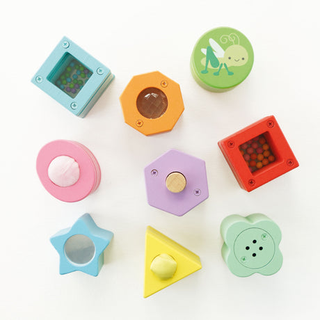 Colorful wooden sensory shape sorter blocks with various textures and activities.