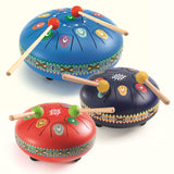Colorful steel tongue drums in blue, navy, and red with wooden mallets and decorative tribal patterns.