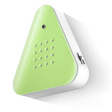 A triangular green device with a smooth surface, featuring a small camera and multiple circular holes on the front. It conveys a modern, minimalist design.