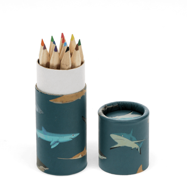 Shark-themed cardboard tube storing colorful mini pencils with lid off against white background.