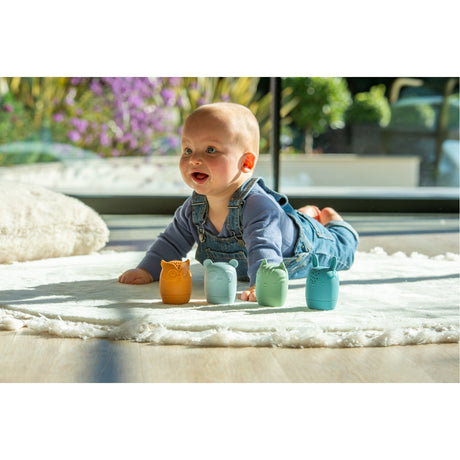 A set of soft silicone animal-shaped squirters in neutral tones, designed for sensory play and water-based fun, perfect for young children.