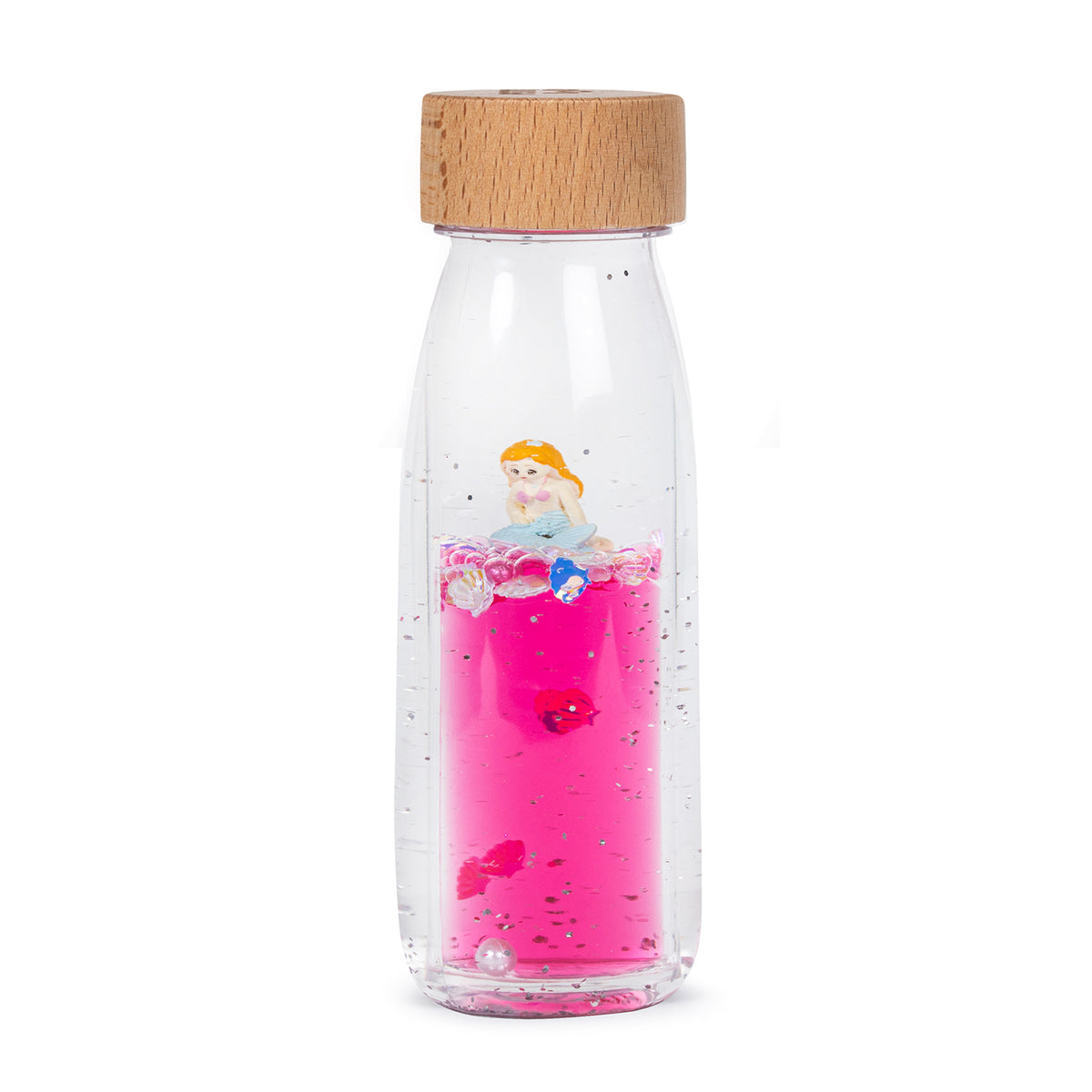 A clear sensory bottle filled with pink liquid, featuring a small floating mermaid figure and decorative glitter.
