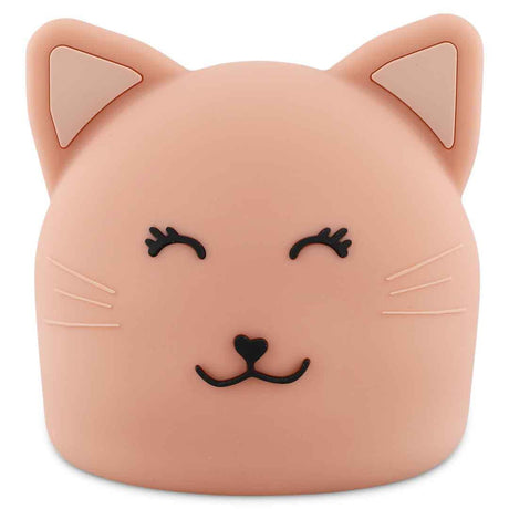 Cute cat-shaped night light in soft peach color with closed eyes and a smiling face. Features pointed ears and whiskers, conveying a playful tone.